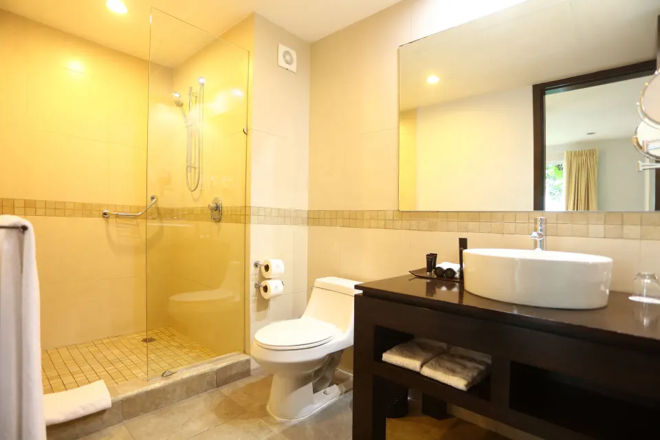 Bathroom with walk-in glass shower and vanity at Bahia Principe Luxury Sian Ka'an