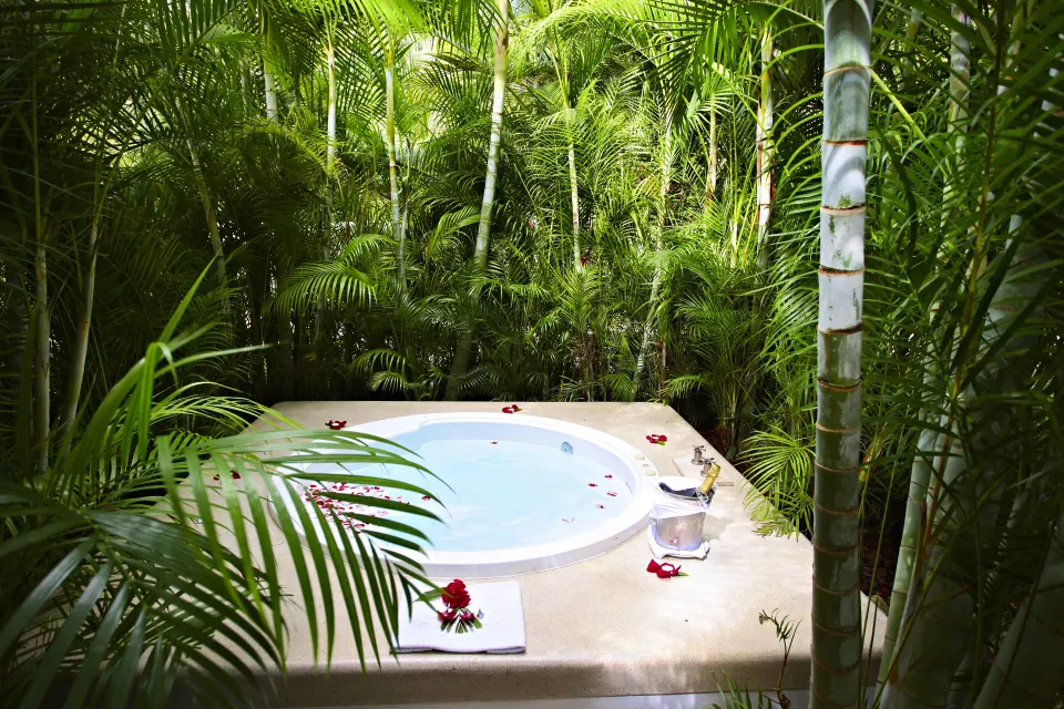 Private suite whirlpool on a lush terrace at Bahia Principe Luxury Sian Ka'an