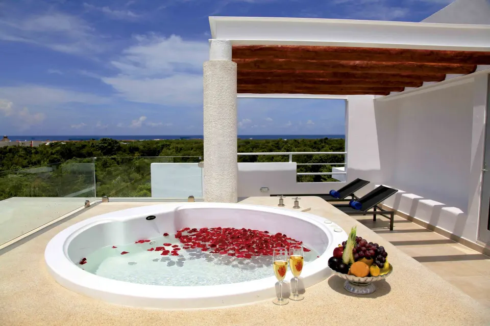 Private rooftop terrace with circular jacuzzi and sun loungers at Bahia Principe Luxury Sian Ka'an