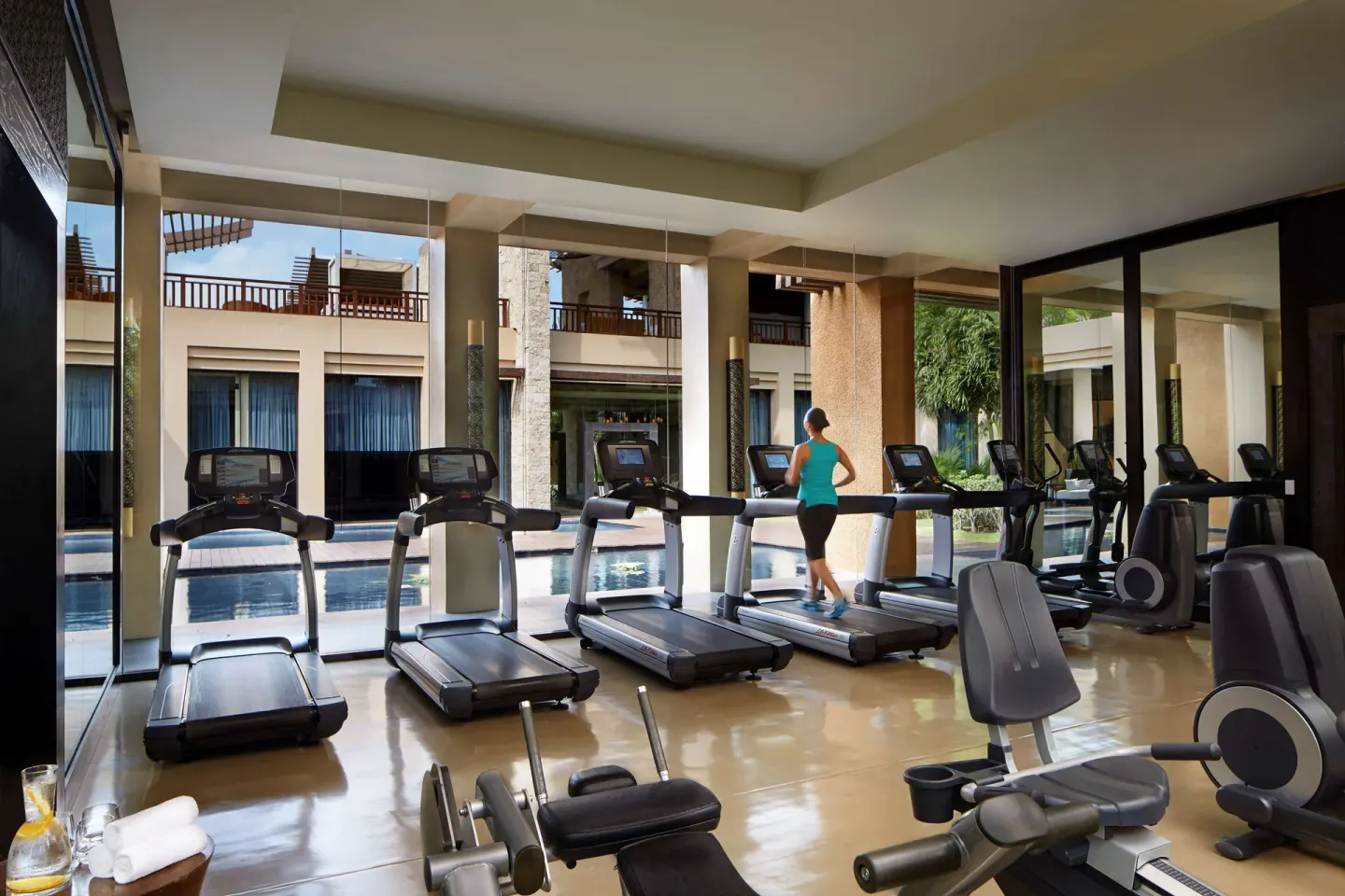 Fitness room with treadmills and pool views at Banyan Tree Mayakoba.