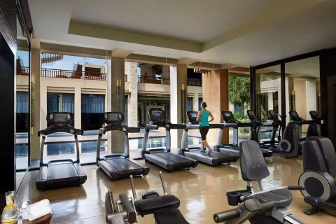 Fitness room with treadmills and pool views at Banyan Tree Mayakoba.