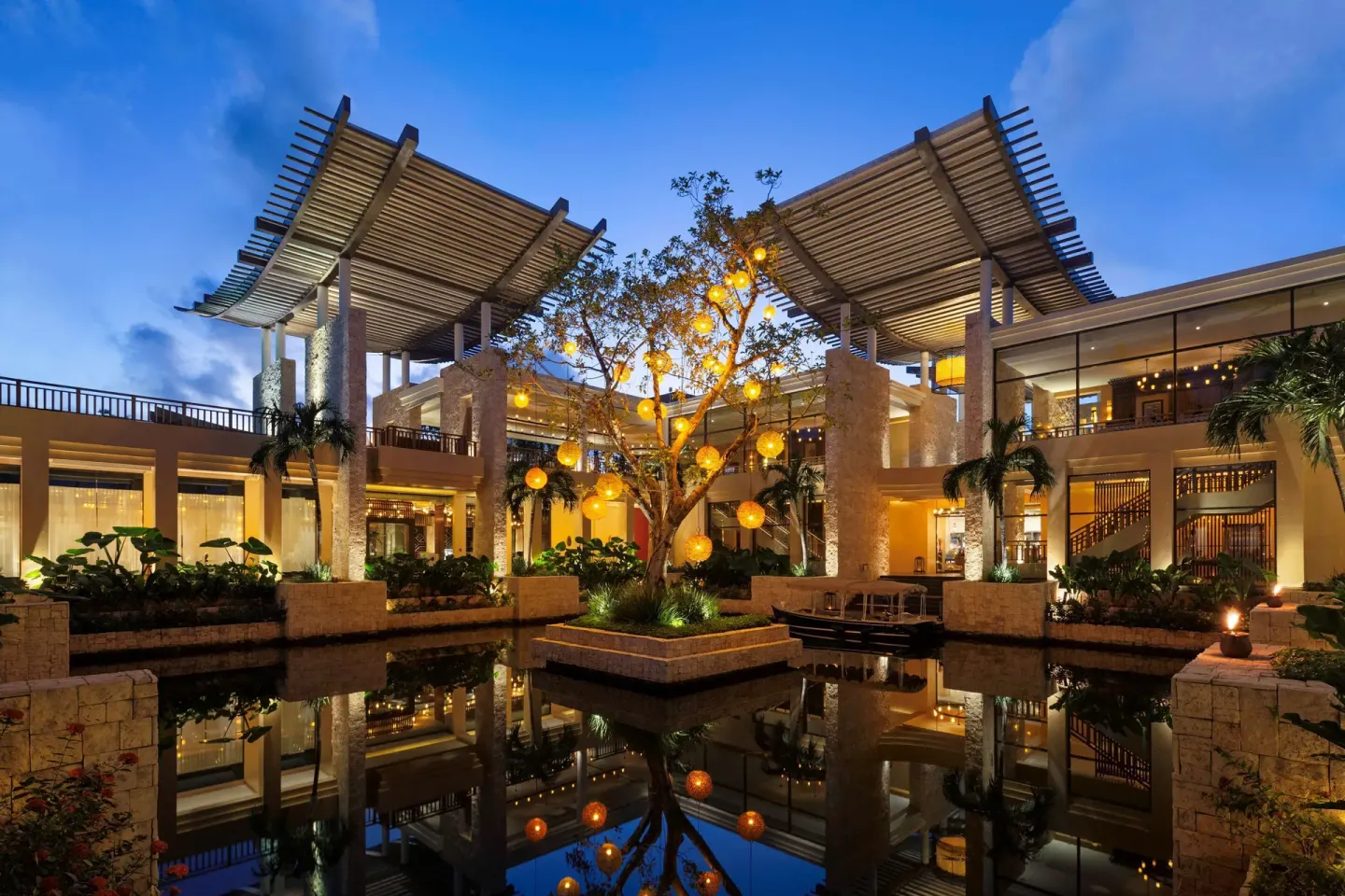 Illuminated resort courtyard and reflecting pool at Banyan Tree Mayakoba.