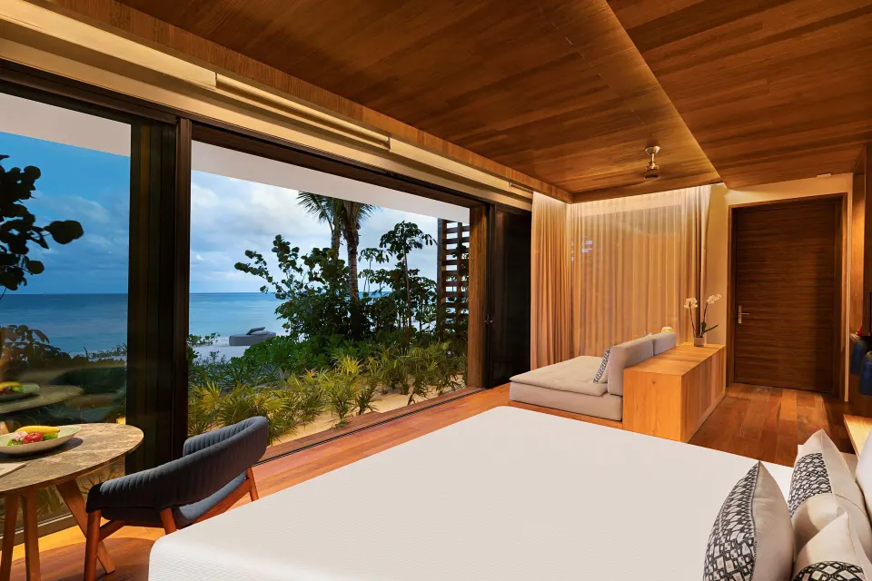 Beachfront Terrace Pool Suite king bed with ocean view at Banyan Tree Mayakoba.