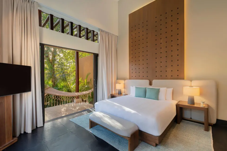 Bliss Pool Villa king bedroom with balcony hammock at Banyan Tree Mayakoba.