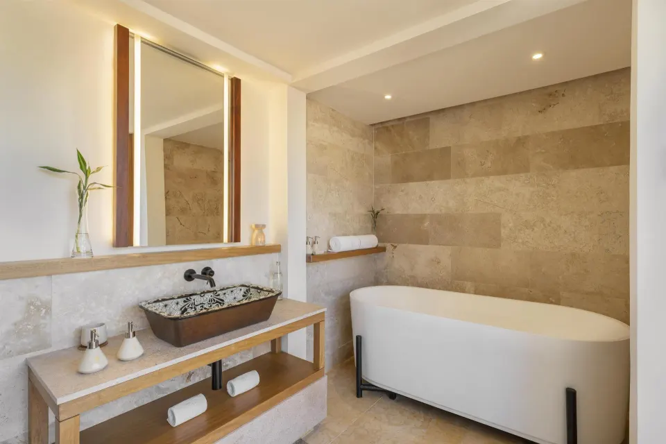 Bathroom with soaking tub and patterned sink at Banyan Tree Mayakoba.