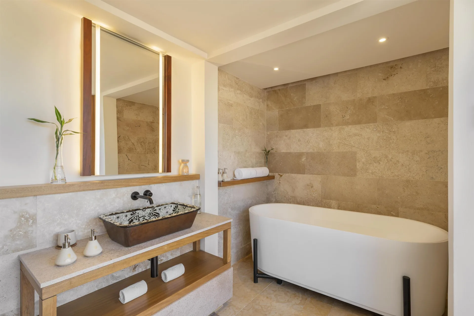Bathroom with soaking tub and patterned sink at Banyan Tree Mayakoba.
