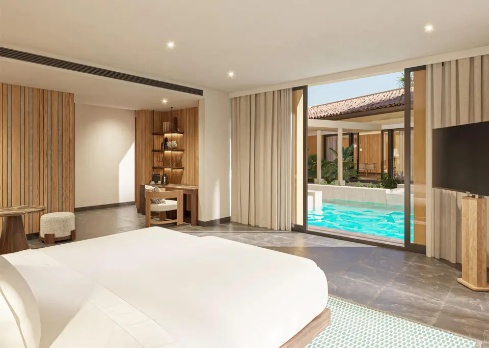 King bedroom overlooking the pool in the Harmony Three-Bedroom Beachfront Pool villa at Banyan Tree Mayakoba.