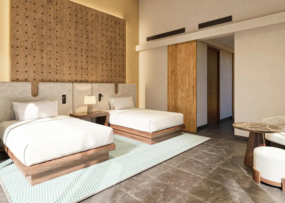 Two twin beds in the Harmony Three-Bedroom Beachfront Pool villa at Banyan Tree Mayakoba.