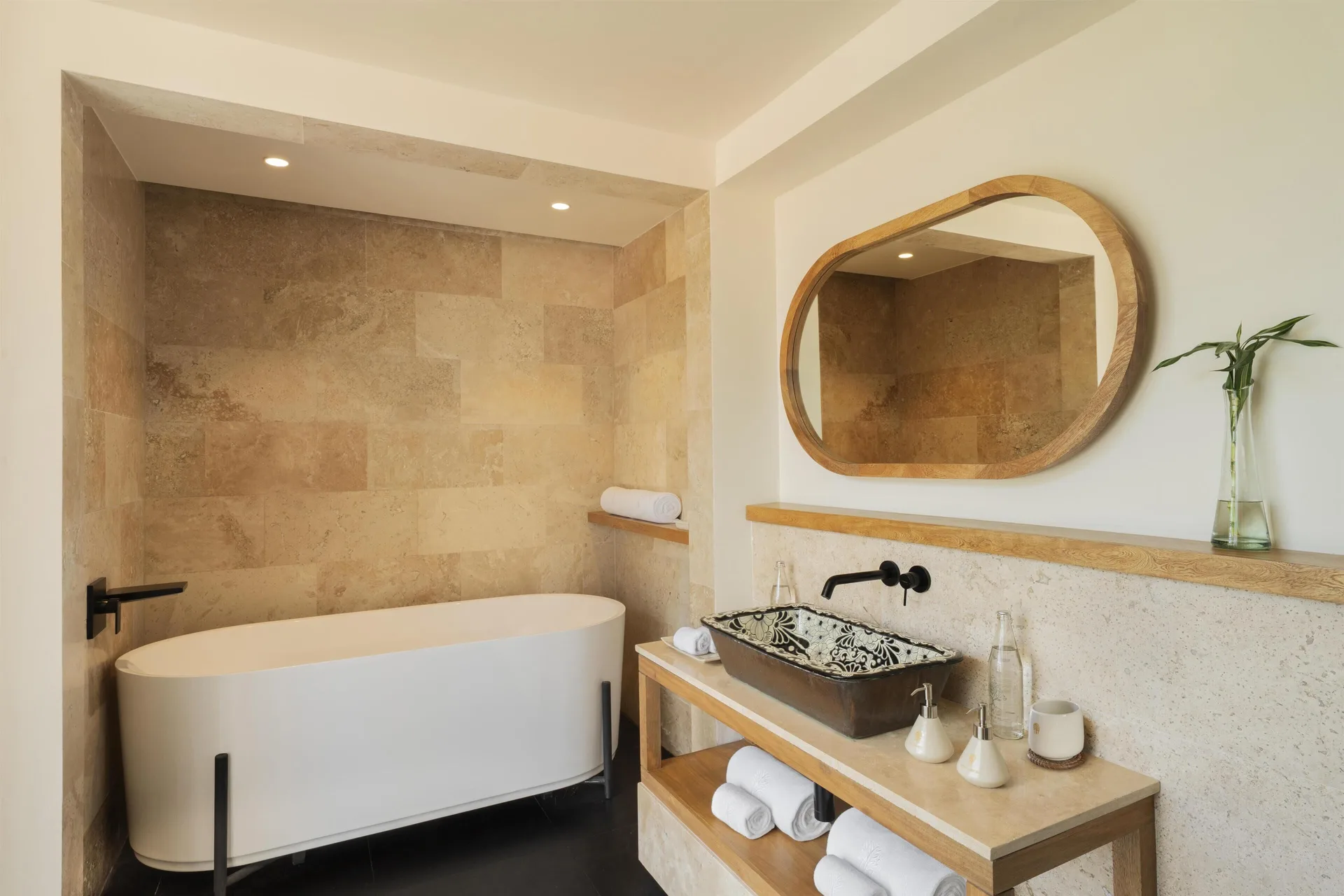 Indoor bathroom with soaking tub in the Harmony Two-Bedroom Lagoon Pool Villa at Banyan Tree Mayakoba.