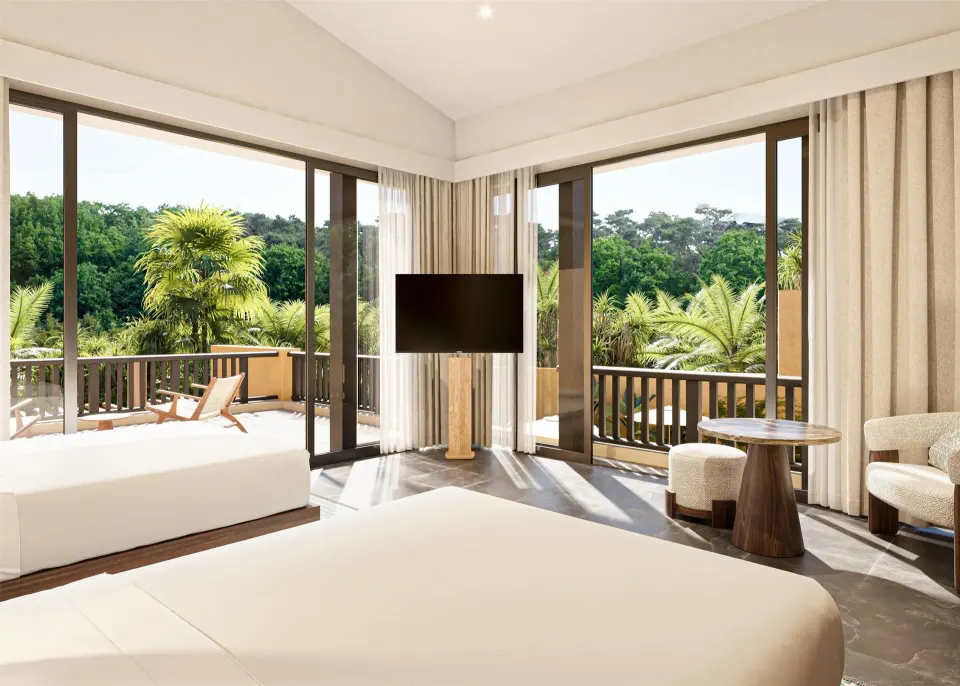 Bedroom with terrace views in the Harmony Two-Bedroom Lagoon Pool Villa at Banyan Tree Mayakoba.