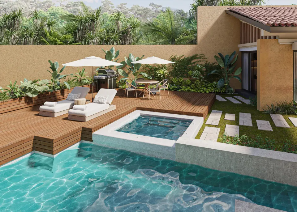 Pool terrace with loungers and dining area at Banyan Tree Mayakoba's Harmony Two-Bedroom Lagoon Pool Villa.