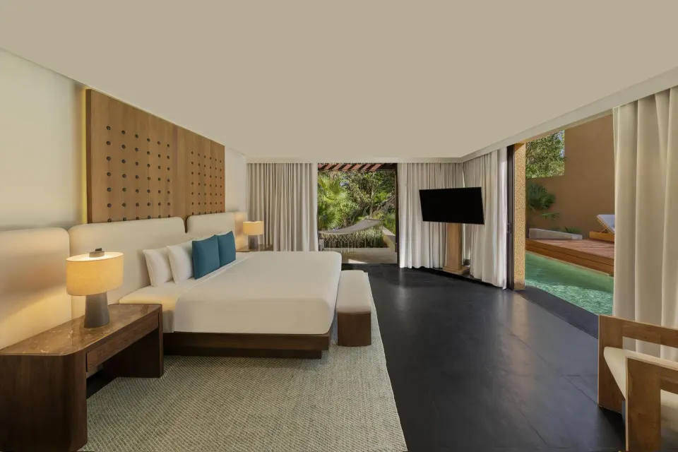 King bedroom of the Serenity Two Bedroom Pool Villa at Banyan Tree Mayakoba with pool access.
