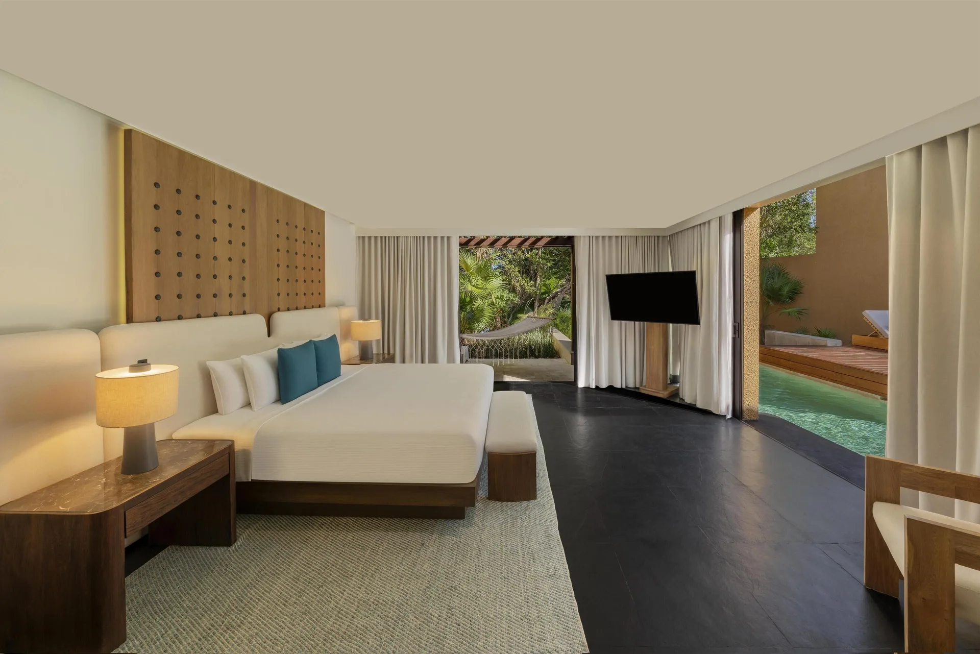 King bedroom of the Serenity Two Bedroom Pool Villa at Banyan Tree Mayakoba with pool access.