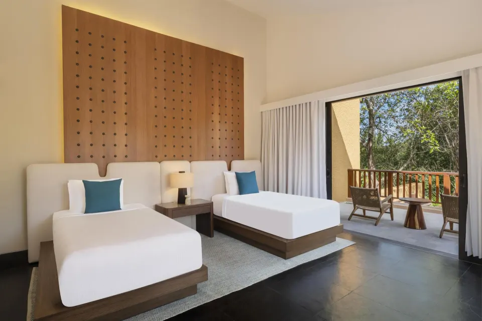 Twin bedroom in the Serenity Two Bedroom Pool Villa at Banyan Tree Mayakoba.
