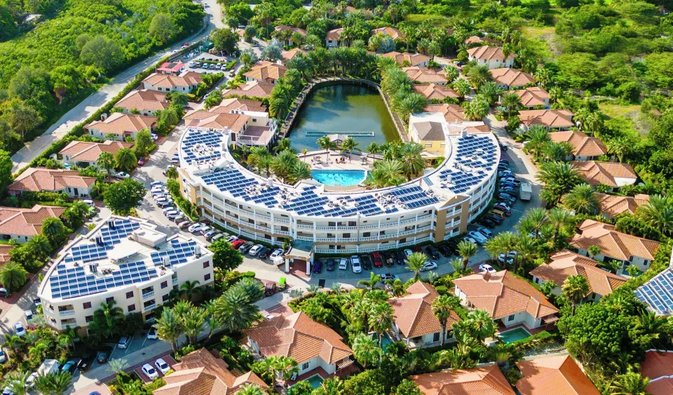 ACOYA Curacao Resort, Villas & Spa full-service resort with villa-style accommodations, gardens, and central pool area in Willemstad, Curaçao.