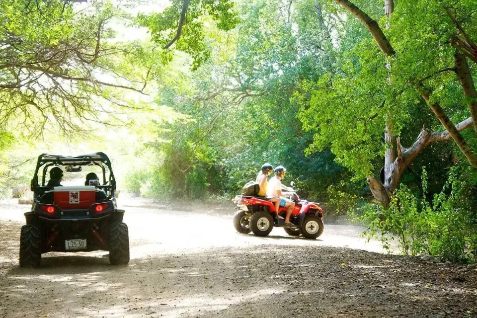 Two all-terrain vehicles on a shaded trail at Baoase Luxury Resort