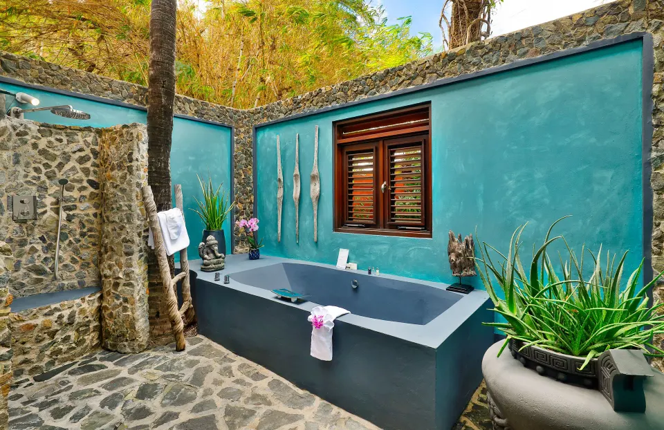 Outdoor private bathtub courtyard at Baoase Luxury Resort
