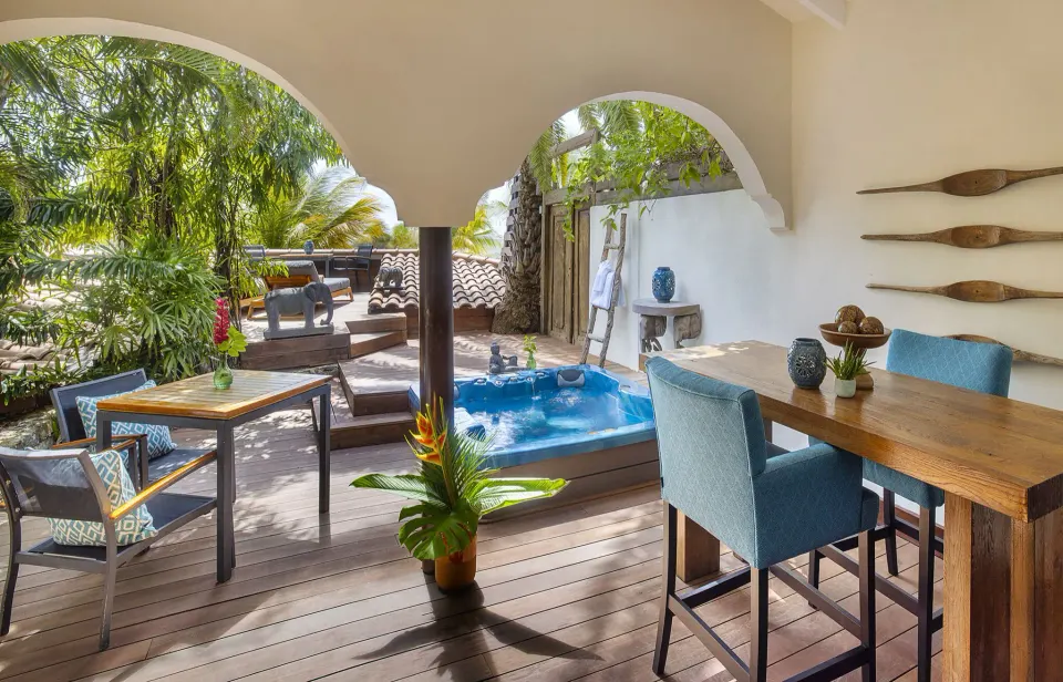 Private Jacuzzi Honeymoon Suite deck with private hot tub and dining seating at Baoase Luxury Resort