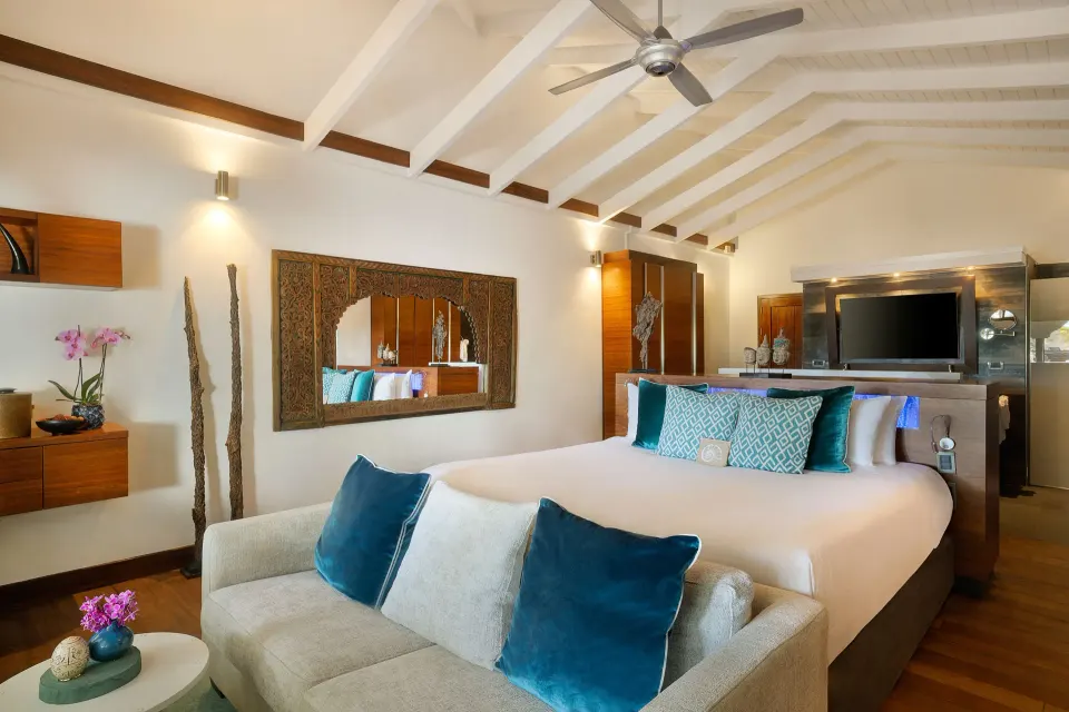 Private Jacuzzi Honeymoon Suite bedroom with king bed and seating at Baoase Luxury Resort