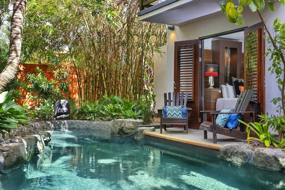 Private pool and patio with open doors to a villa bedroom at Baoase Luxury Resort
