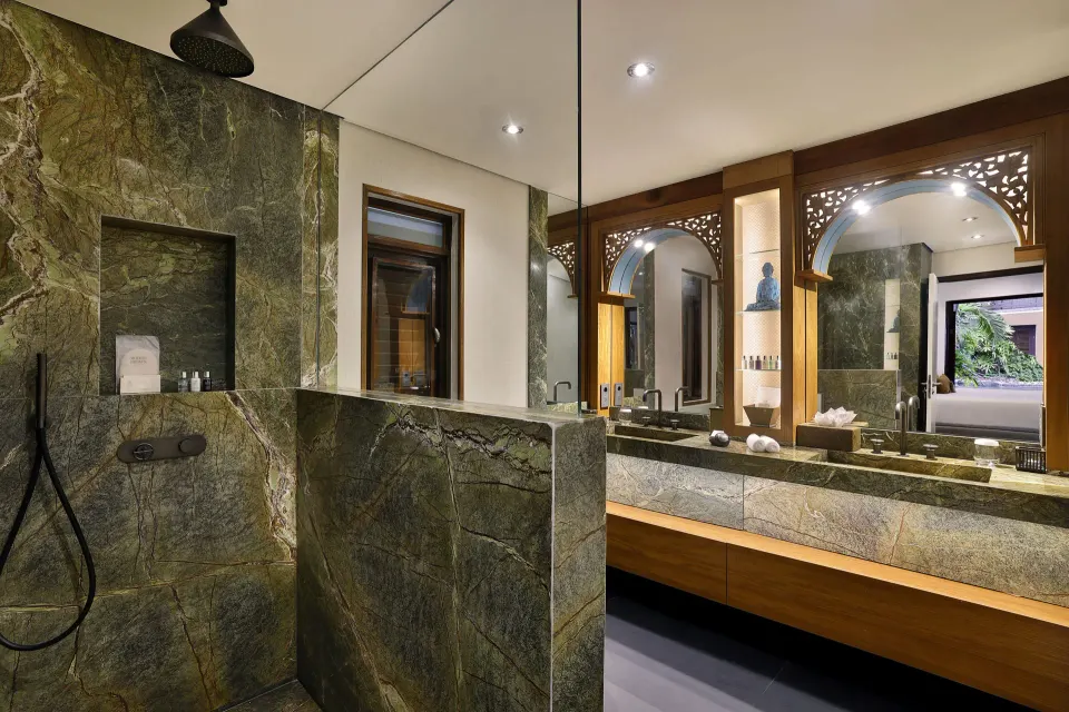 Marble bathroom with double vanity and mirror in a Tropical Pool Villa at Baoase Luxury Resort
