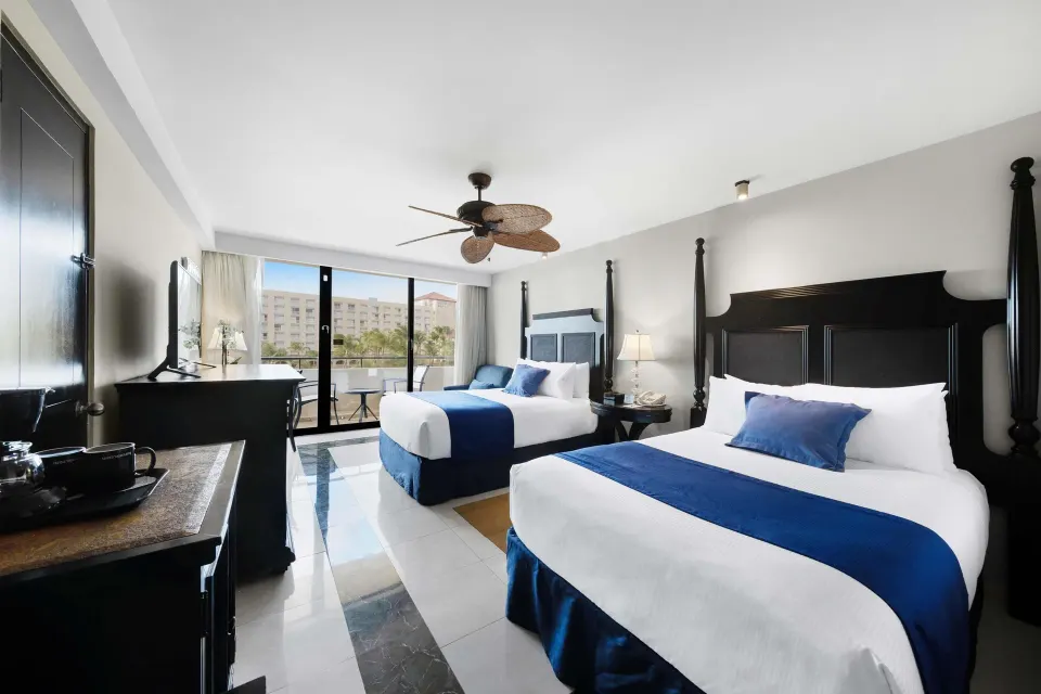 Deluxe Ocean View room with two beds and balcony at Barceló Aruba.