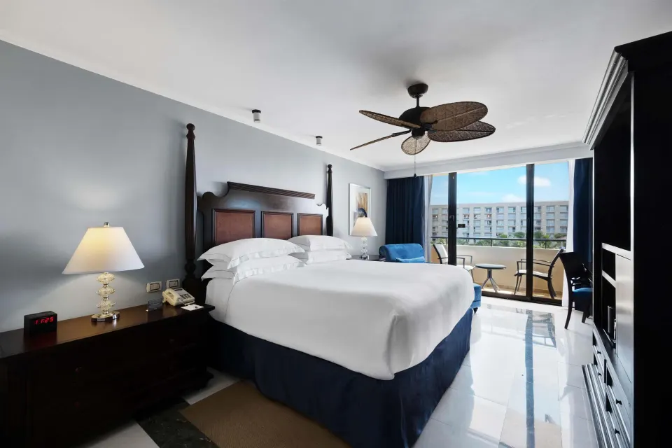 Luxury Ocean View Royal Level room with king bed and balcony at Barceló Aruba.