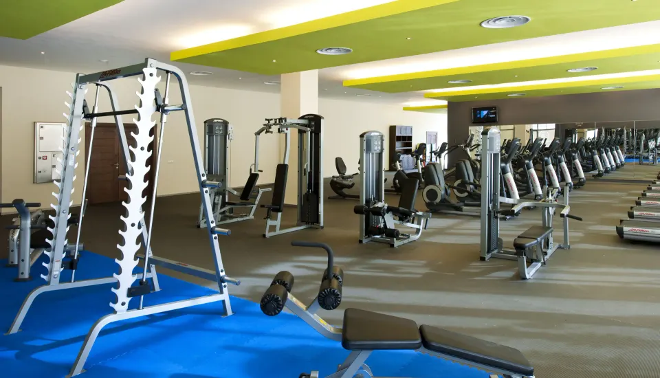 Fitness center with weight machines and cardio equipment at Barceló Bávaro Beach.