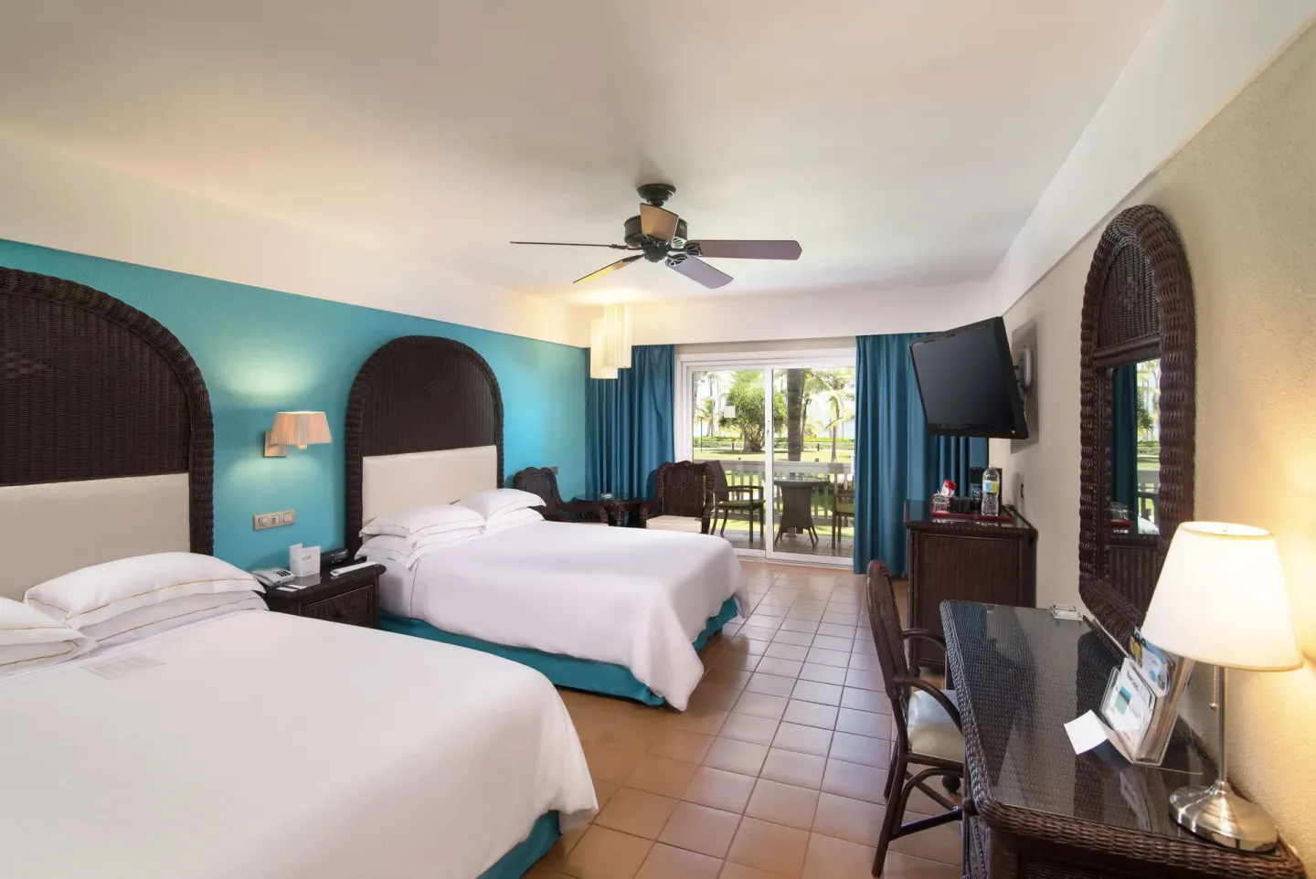 Superior Room with two double beds and balcony doors at Barceló Bávaro Beach.