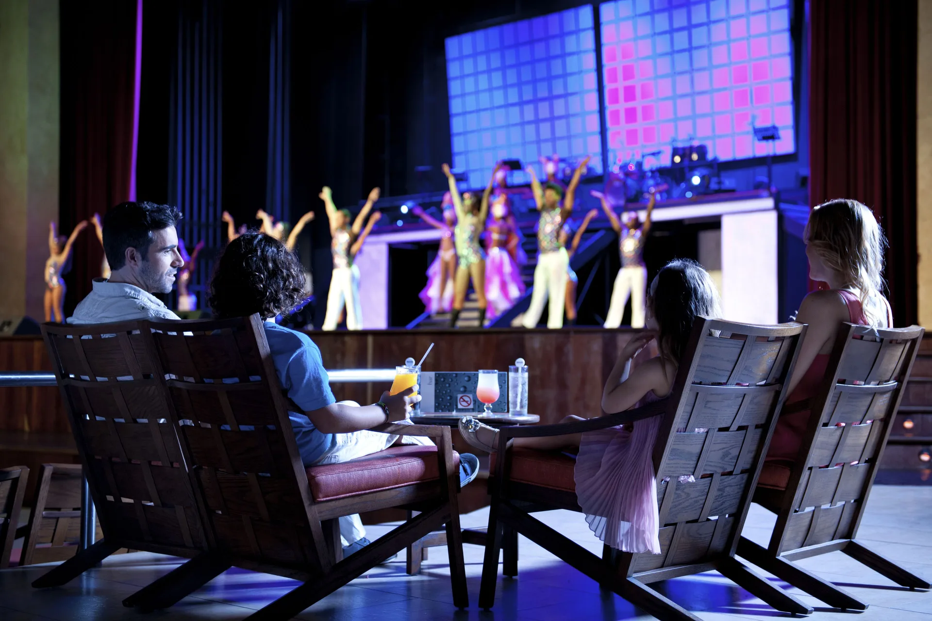 Guests watch a colorful stage performance at Barceló Bávaro Palace.