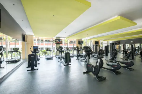Fitness center with cardio machines and weight equipment at Barceló Bávaro Palace.