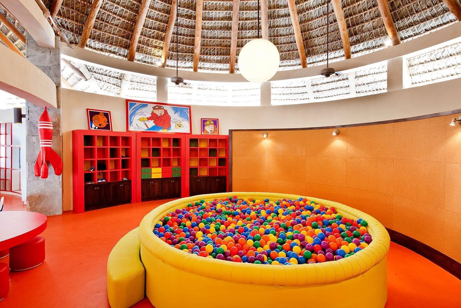 Kids club ball pit under a thatched roof at Barceló Bávaro Palace.