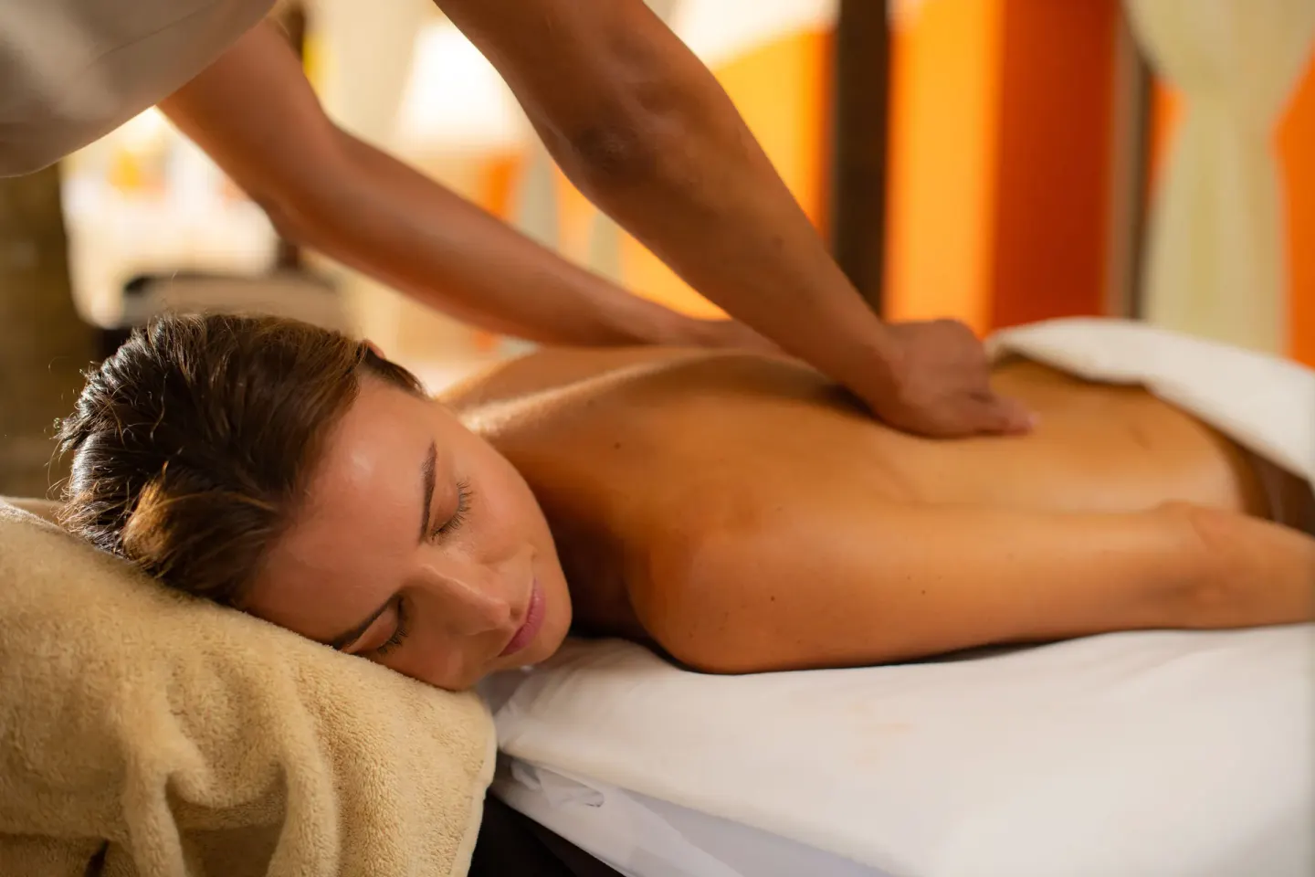 Guest receiving a massage on a treatment table at Barceló Bávaro Palace.