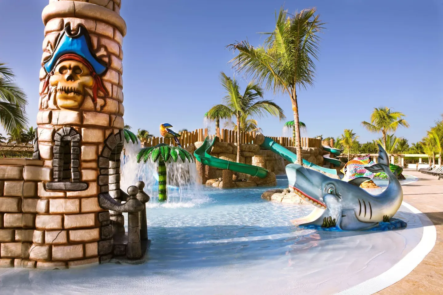 Pirate-themed kids pool with slides and a shark figure at Barceló Bávaro Palace.