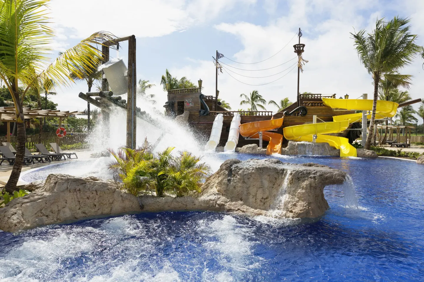Water sprays and colorful slides fill the splash pool at Barceló Bávaro Palace.