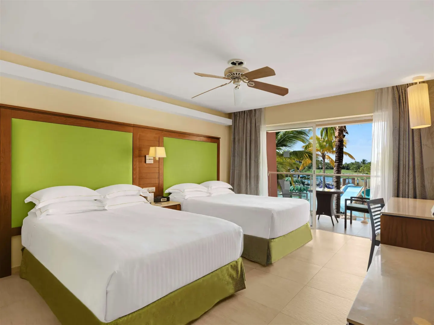 Family Room with two beds and balcony view at Barceló Bávaro Palace.
