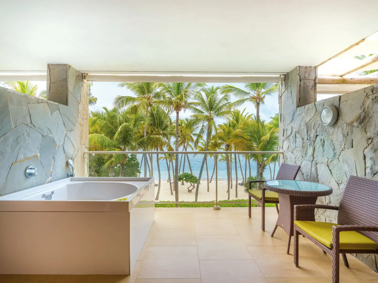 Sea-view balcony with tub and seating at Barceló Bávaro Palace.