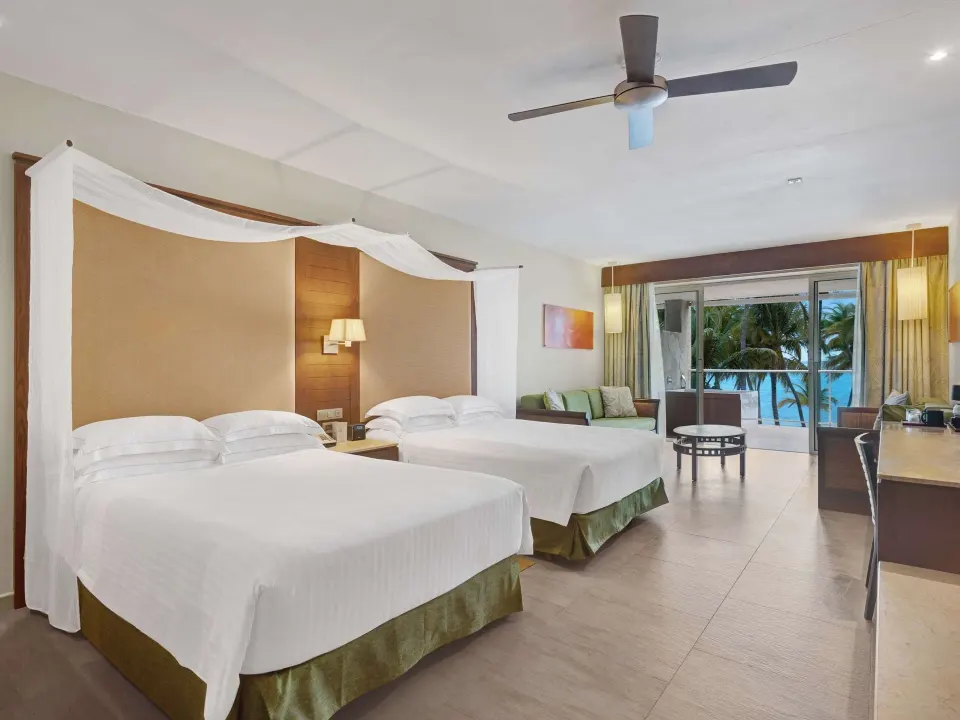 Junior Suite Sea View with two beds and balcony view at Barceló Bávaro Palace.