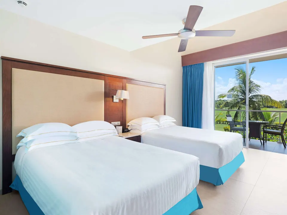 Superior Room with two double beds and a balcony at Barceló Bávaro Palace.