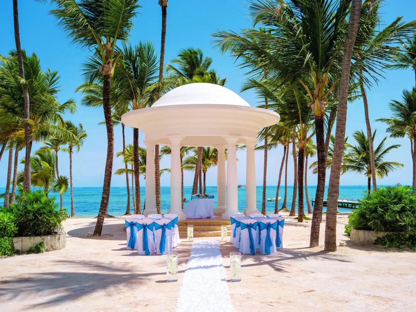 Beachfront wedding gazebo with aisle and chairs at Barceló Bávaro Palace.