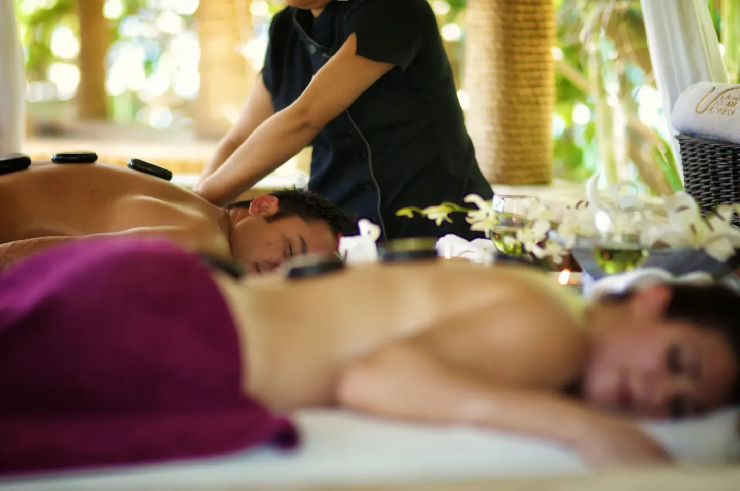 Side-by-side massage treatment with therapist in a spa cabana at Barceló Huatulco.