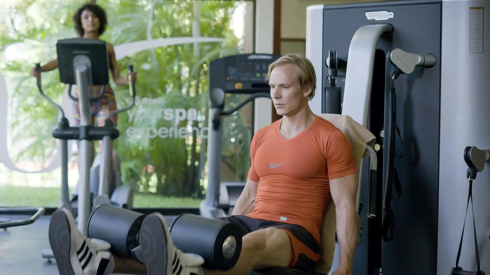 Guests use cardio and strength machines in the fitness center at Barceló Huatulco.