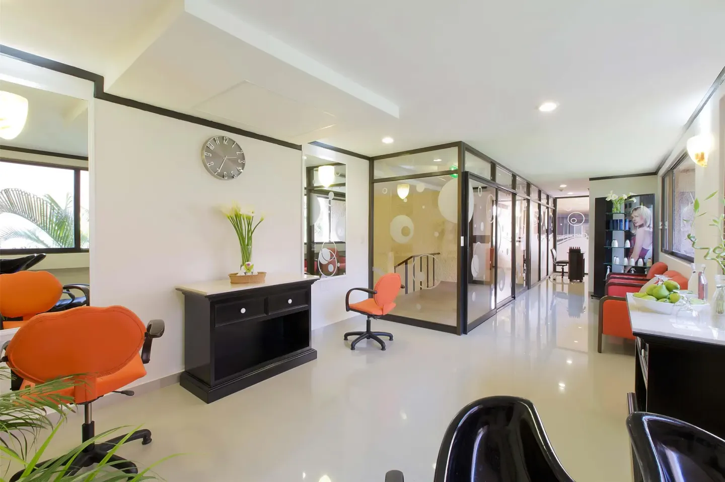 Bright salon and spa corridor with styling chairs at Barceló Huatulco.