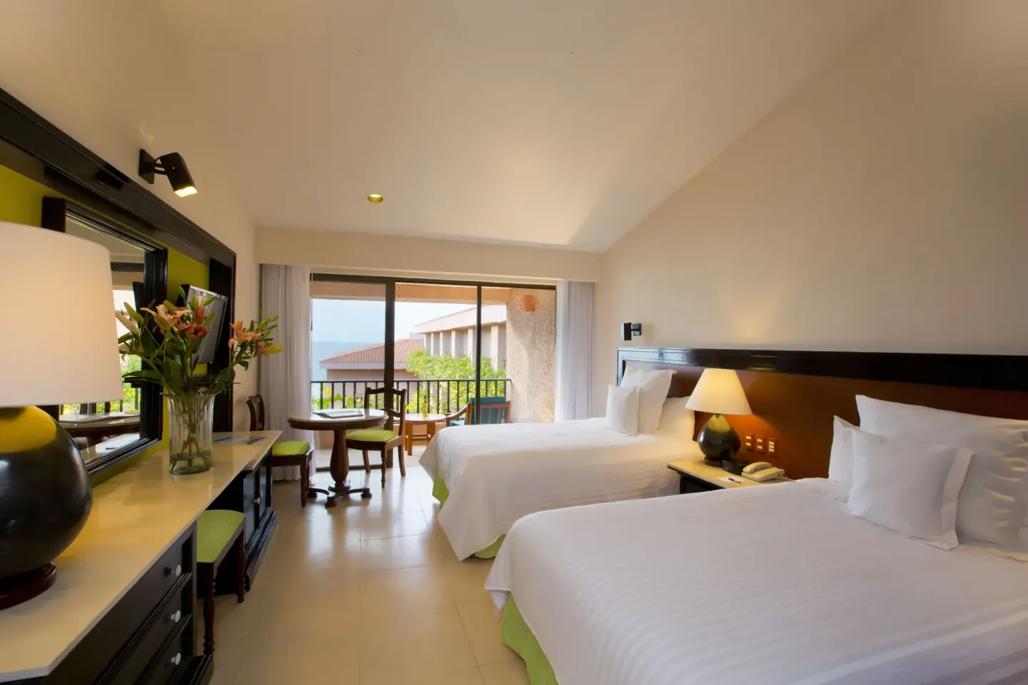 Deluxe Ocean View room with two beds and balcony at Barceló Huatulco.