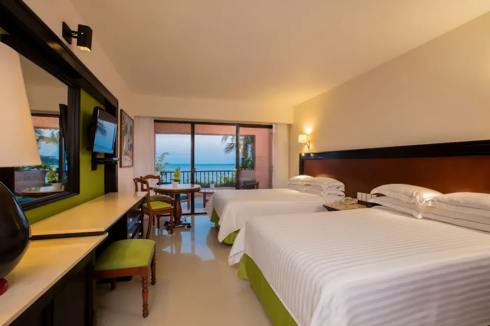 Deluxe Ocean View room with two beds facing the sea at Barceló Huatulco.
