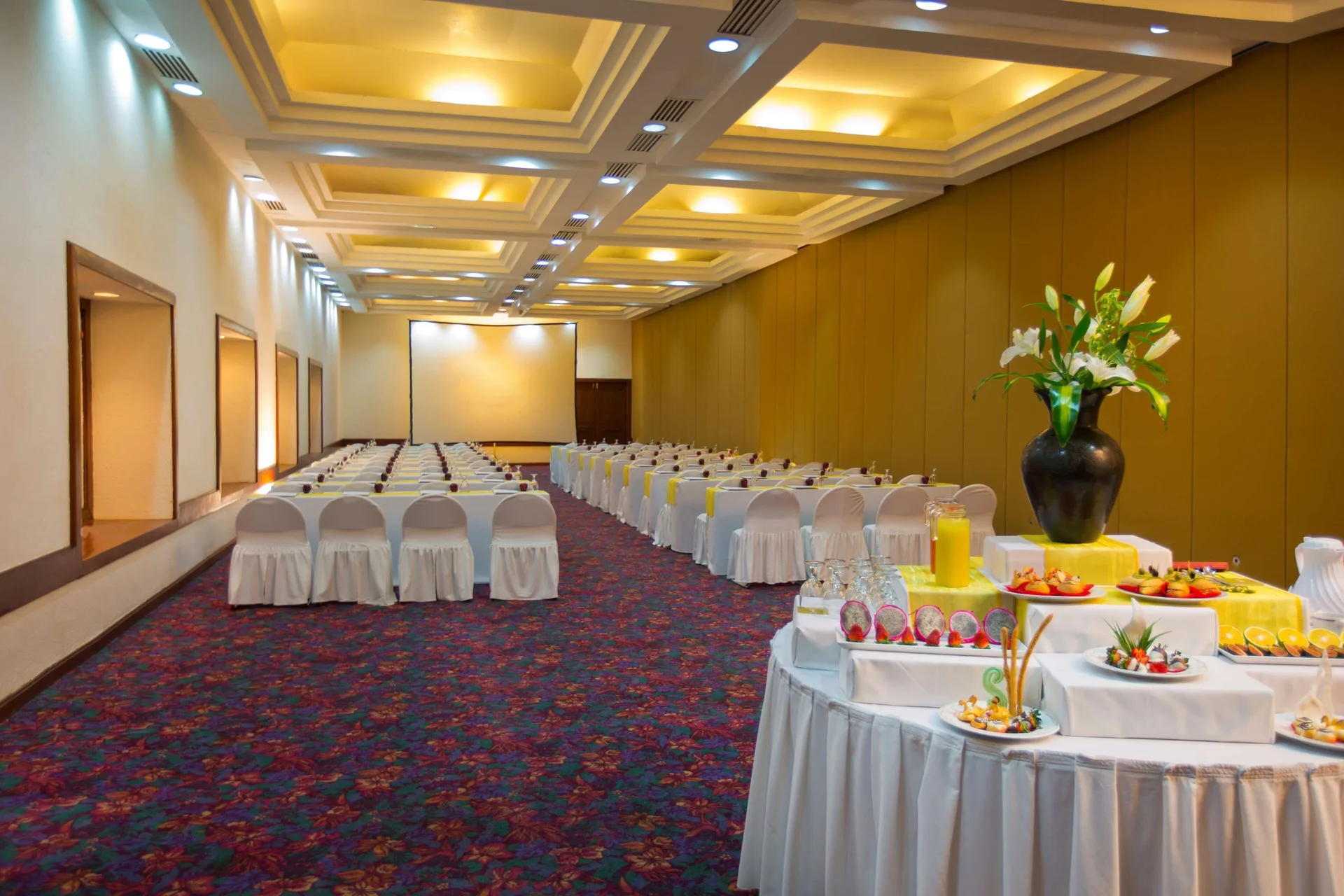 Conference room with rows of chairs and a refreshment table at Barceló Huatulco.