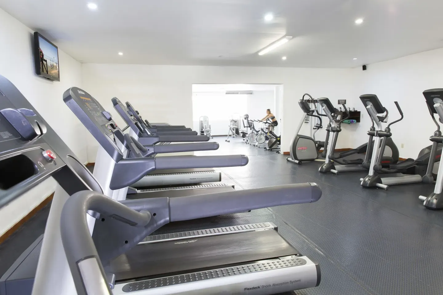 Treadmills and cardio machines line the fitness room at Barceló Ixtapa.