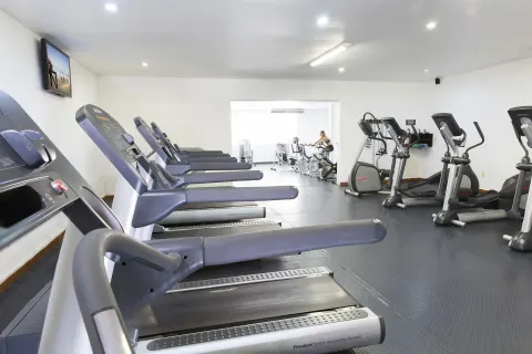 Treadmills and cardio machines line the fitness room at Barceló Ixtapa.