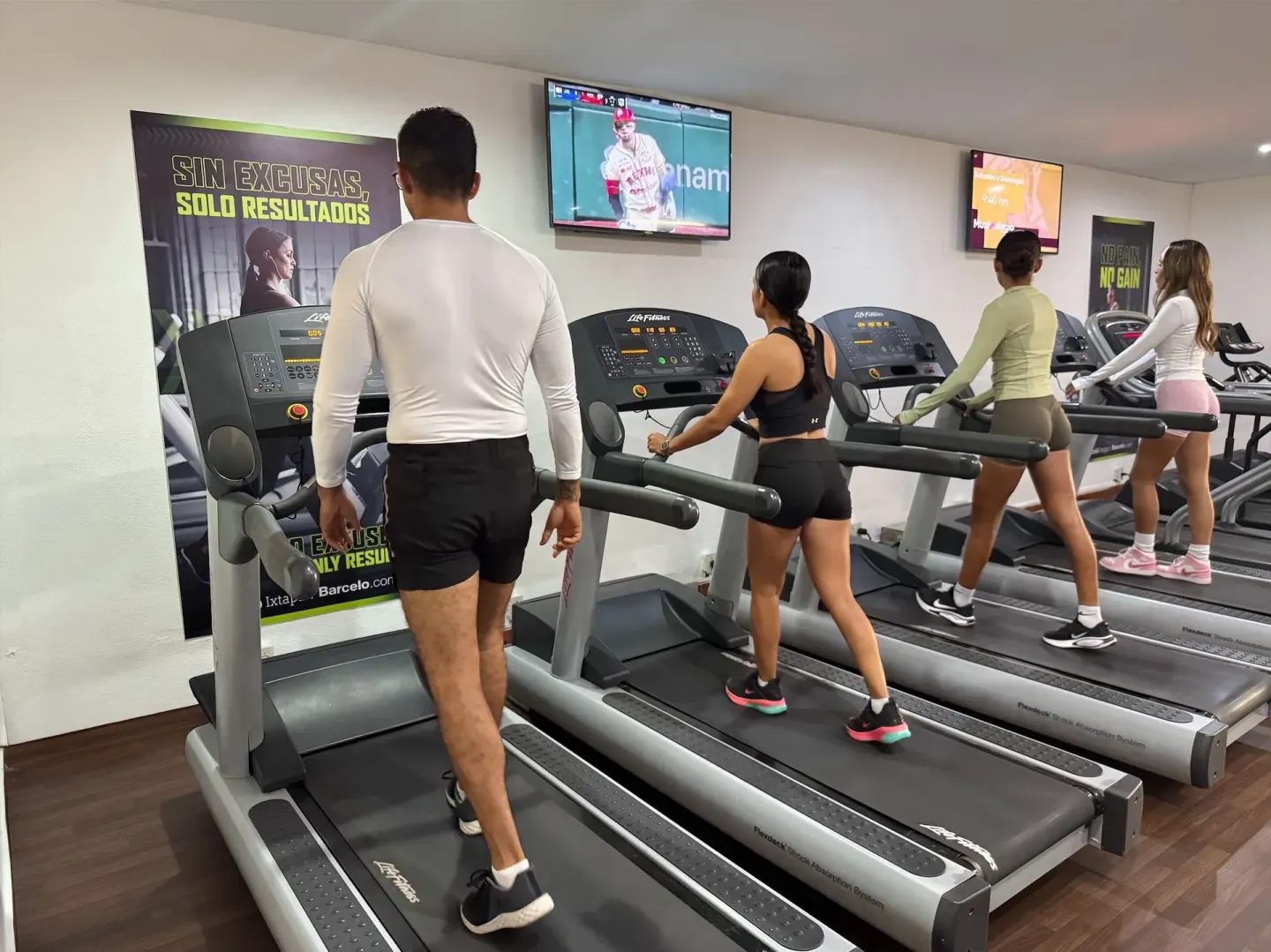 Guests walk on treadmills in the fitness room at Barceló Ixtapa.