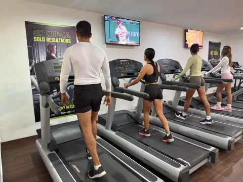 Guests walk on treadmills in the fitness room at Barceló Ixtapa.